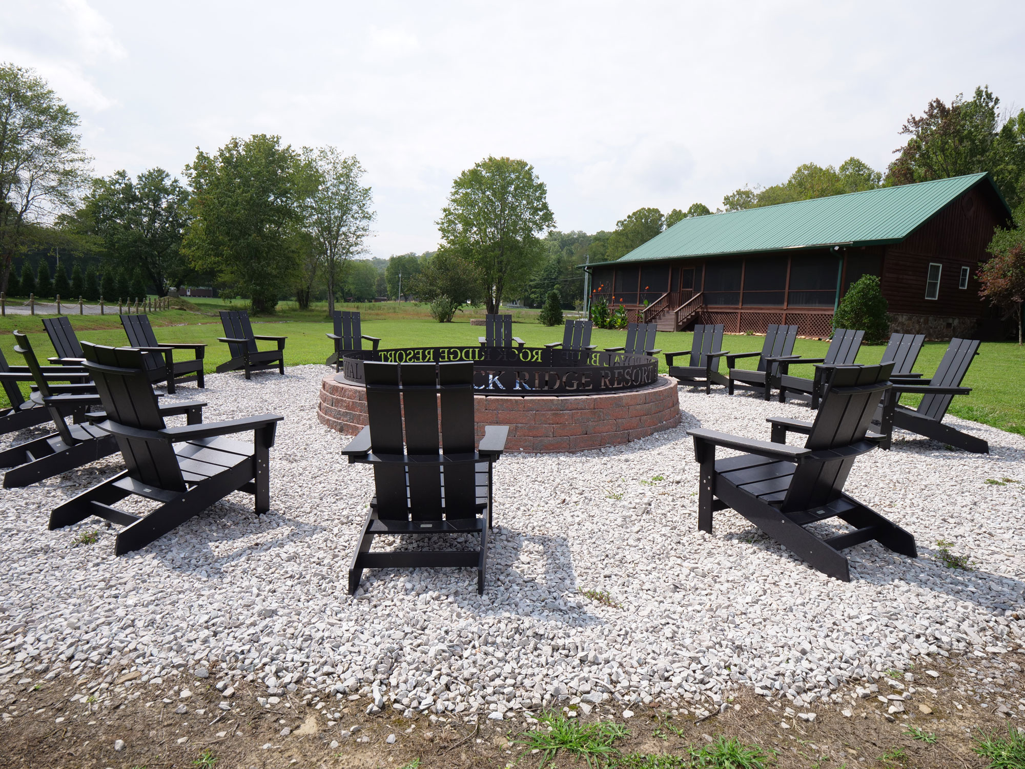 Communal fire pit with Adirondack chairs